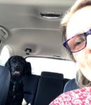 Lynn Goad in car with her dog