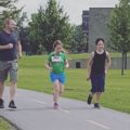 children and coach jogging