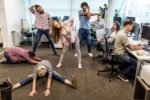 People stretching in an office