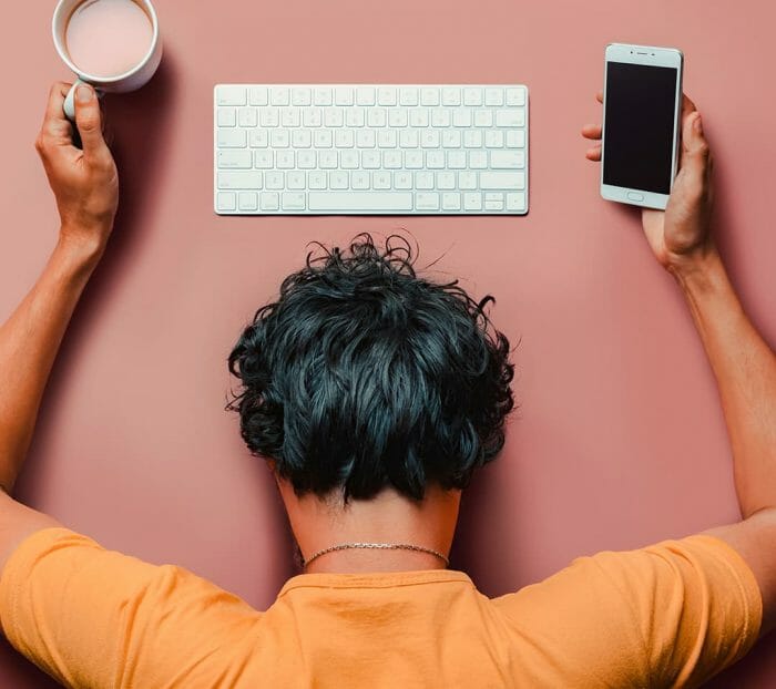 person exhausted at work desk