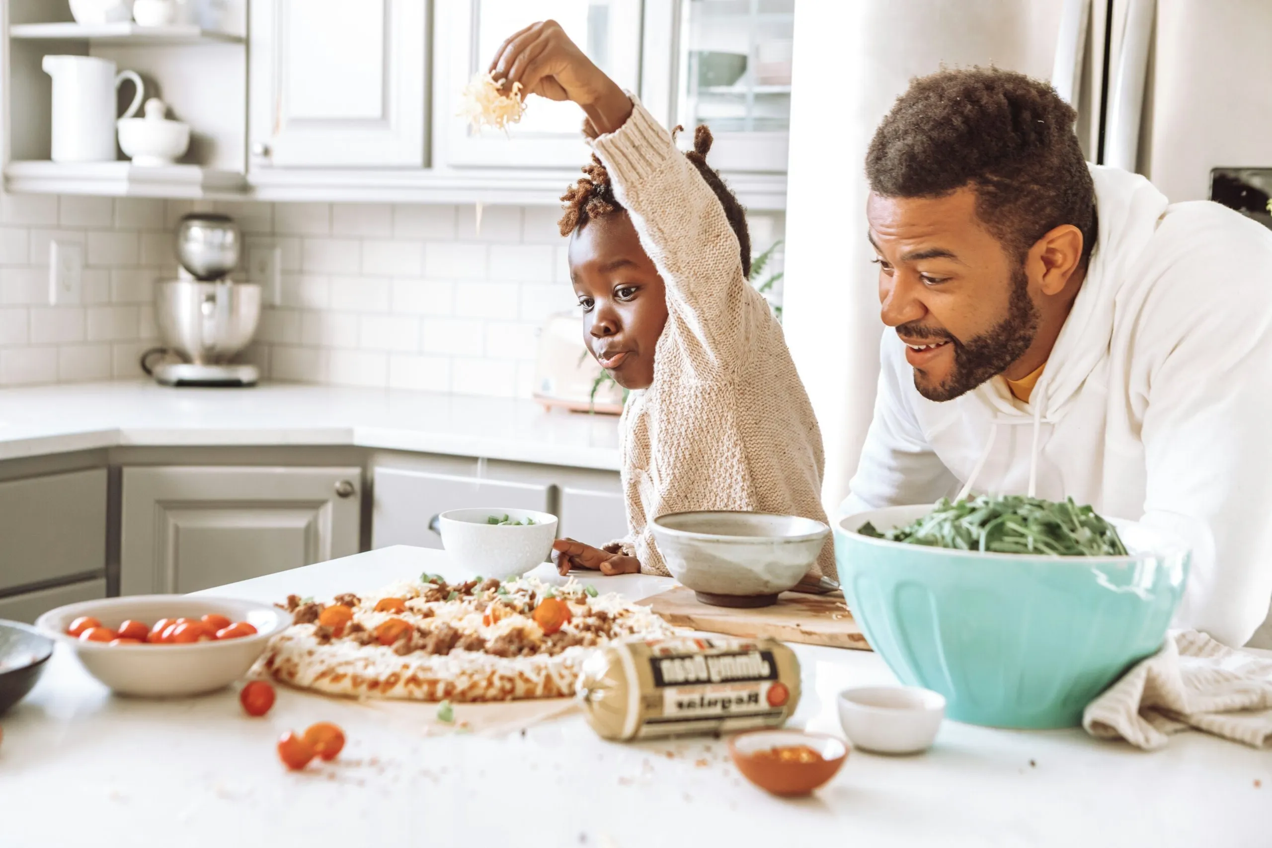 Making cooking with his son